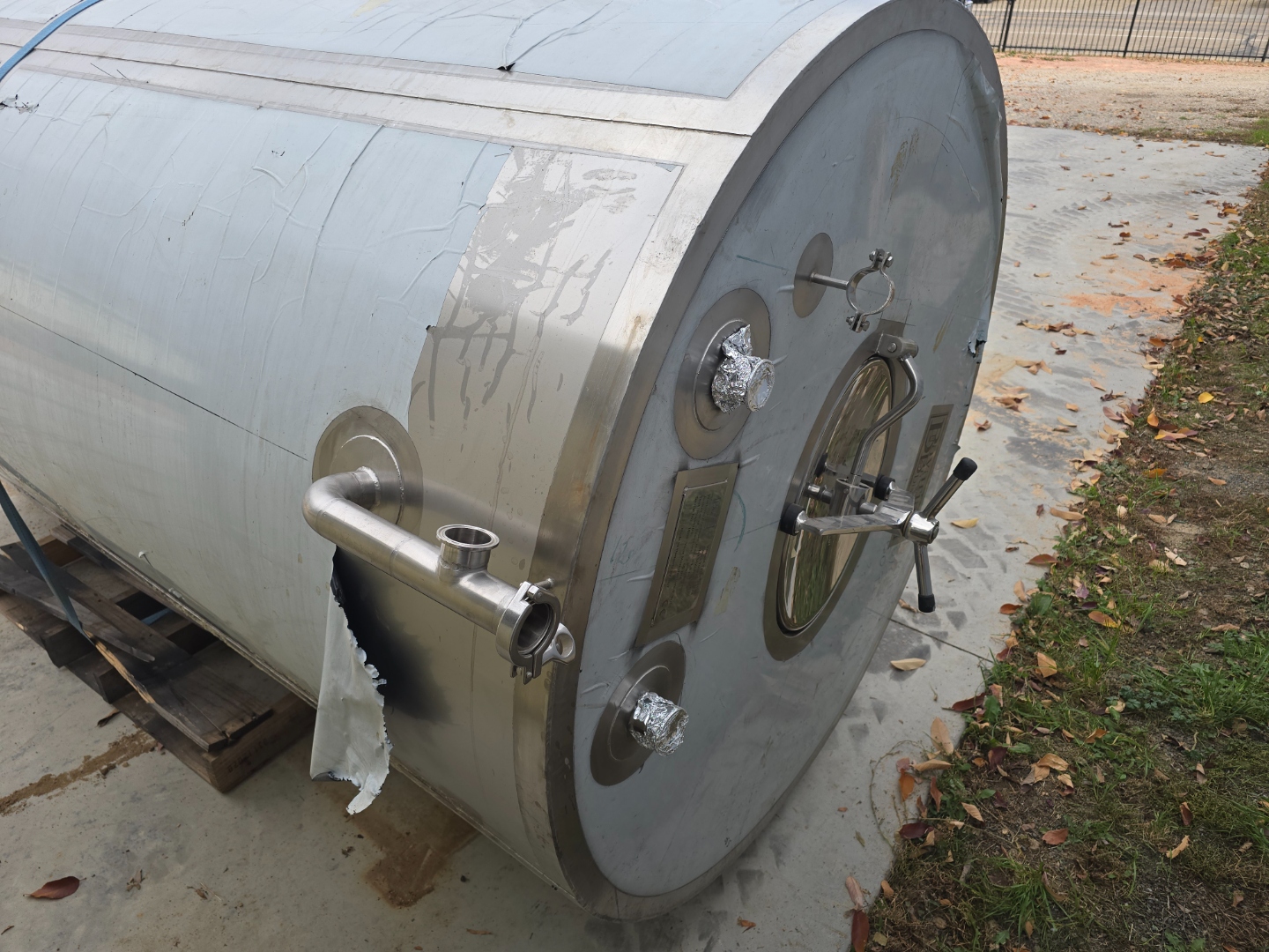 End view showing manway, ports, and fittings