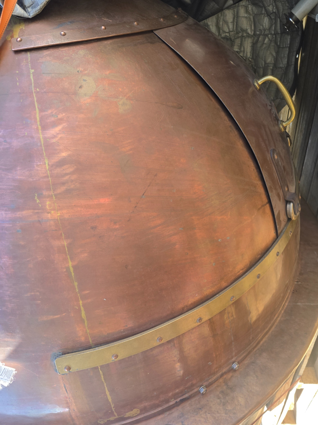 Copper dome detail showing brass band and handle