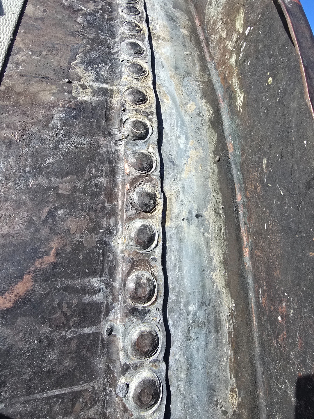 Close-up of original riveted seams on copper kettle